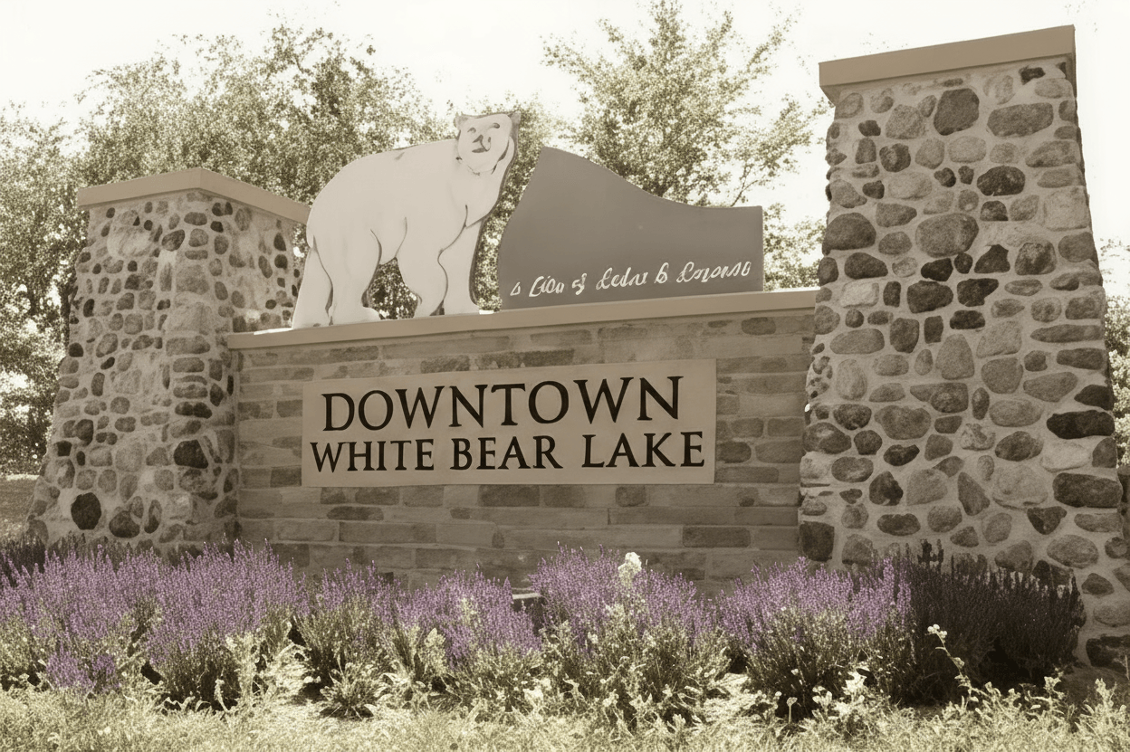 Downtown White Bear Lake stone sign with flowers